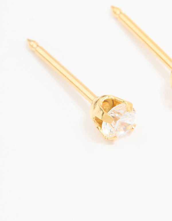Showcasing 24K gold plated surgical stainless steel 3MM cubic zirconia piercing stud featuring clear gemstone and secure closure close up view