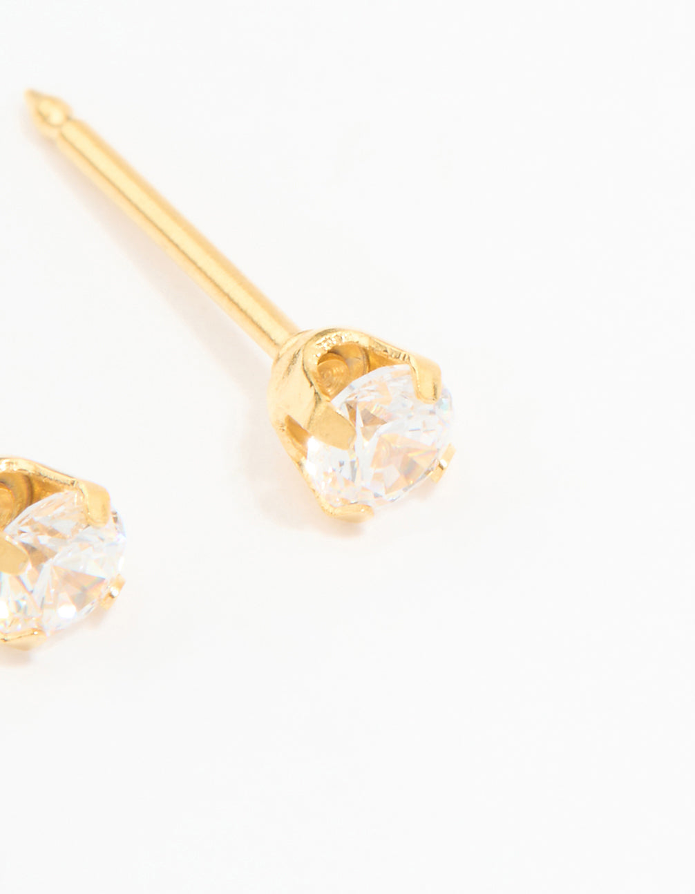 Highlighting 24K gold plated surgical stainless steel 3MM cubic zirconia piercing stud with clear gemstone and prong setting post detail view