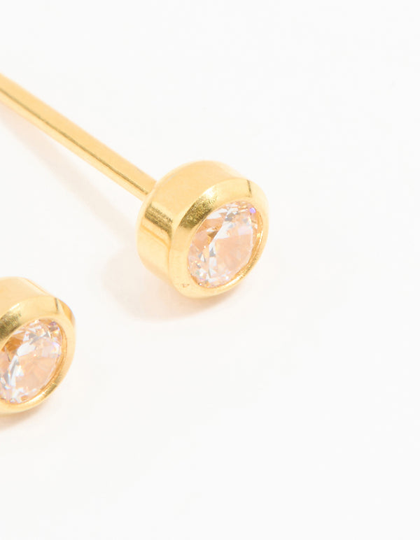 Showcasing 24K gold plated surgical stainless steel 3MM cubic zirconia bezel piercing studs with crystal design and stud closure close up view