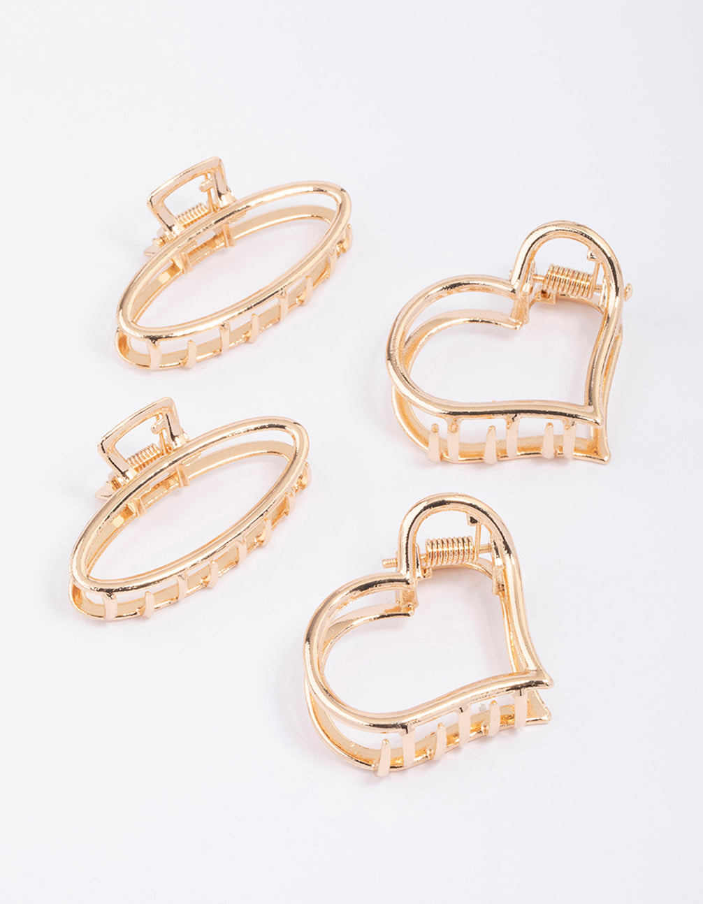 Featuring solid heart and oval gold hair claw clip 4-pack front view