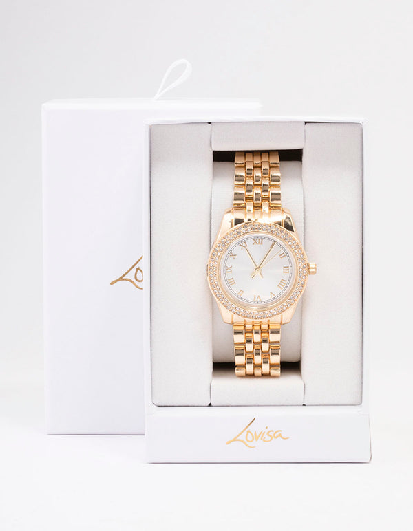 Presenting gold diamante encrusted watch with white dial featuring roman numerals, round shape, designed for women, formal occasions, analog type, and link band strap case detail view