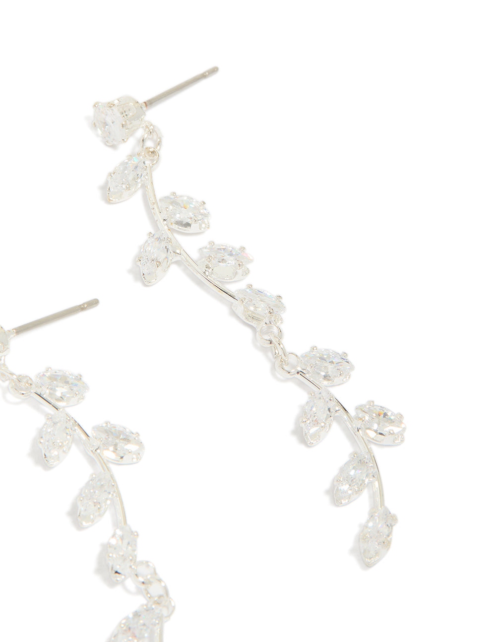 Displaying dainty long swirling cubic zirconia vine drop earrings with leaf embellishments and silver plated construction post detail view