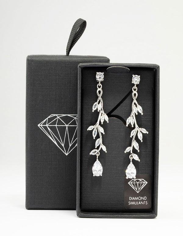 Showcasing silver cubic zirconia vine leaf drop earrings with clear stones in a front view