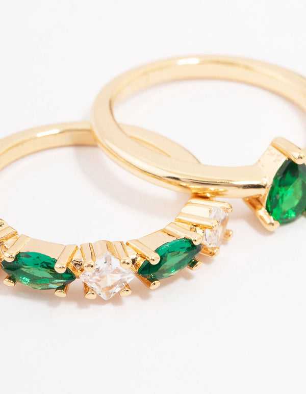 Featuring gold plated alternating cubic zirconia pear stacking ring pack with emerald cut stones close up view