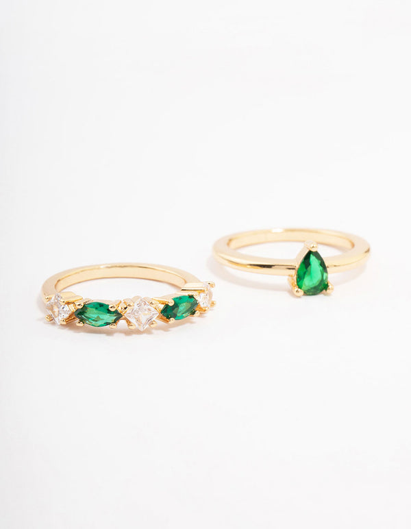 Showcasing gold plated alternating cubic zirconia pear stacking ring pack with emerald cut stones front view