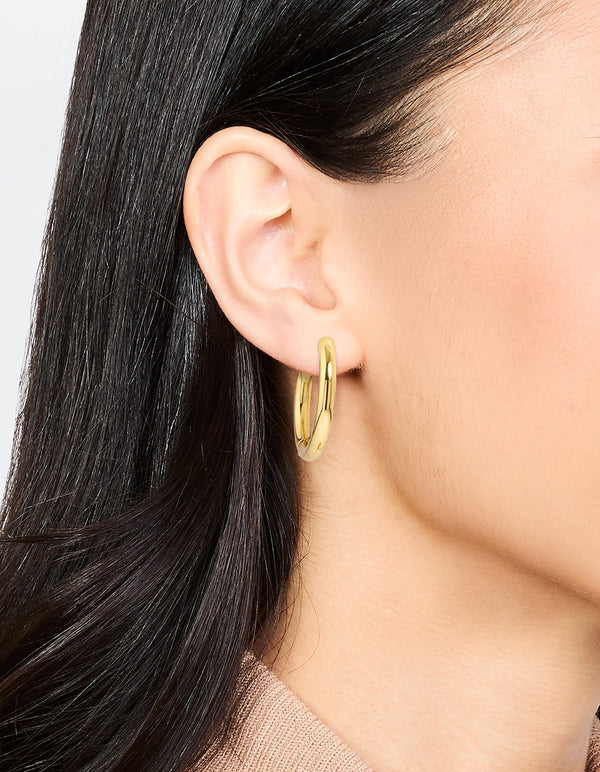 Discover waterproof gold plated stainless steel clicker hoop earrings in 24 MM on ear view