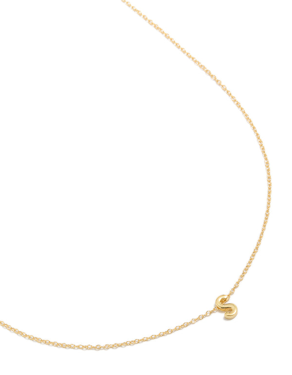 Showcasing a gold plated sterling silver letter S necklace with initials close up view