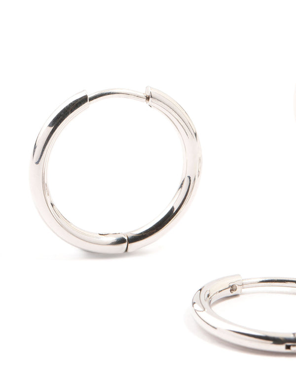 Highlighting waterproof stainless steel mini hoop earrings in a 2-pack in silver close up view