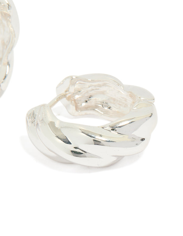 Highlighting silver plated twisted hoop earrings with statement detailing post detail view