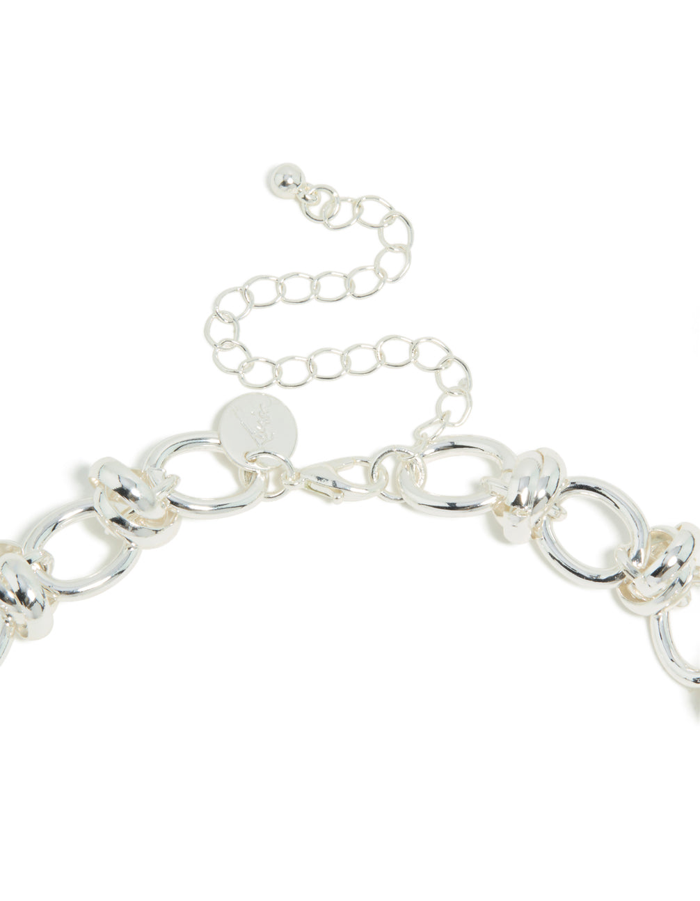 Highlighting a silver plated knotted chain necklace clasp detail view