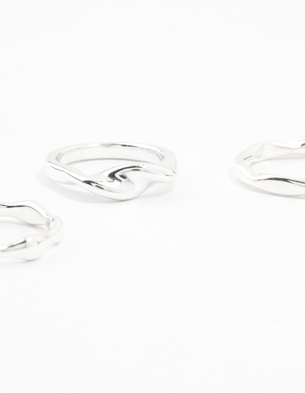 Designed with silver plated material, these irregular stacking rings 3-pack side detail view