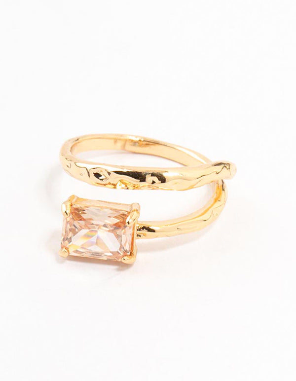 Beautifully crafted gold plated rectangular fine wrapped ring with pink color crystal in statement styling close up view