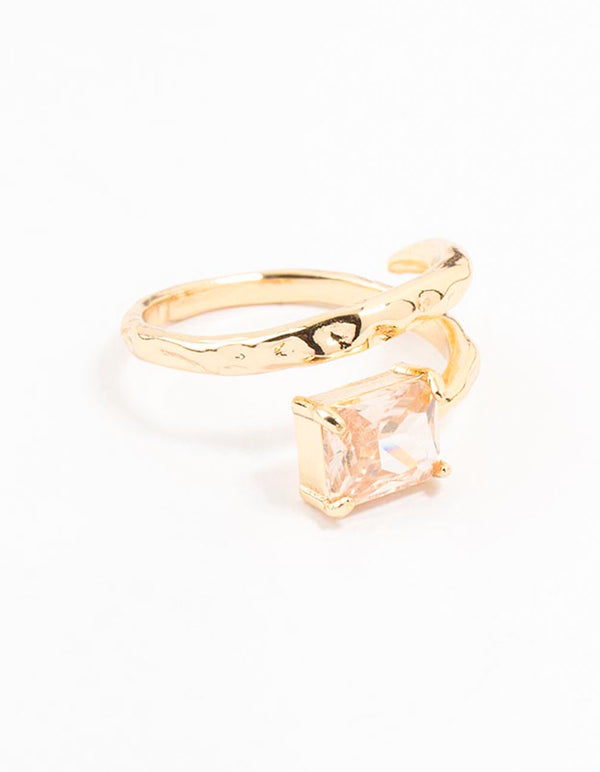 Showcasing a gold plated rectangular fine wrapped ring featuring pink color crystal and statement styling front view