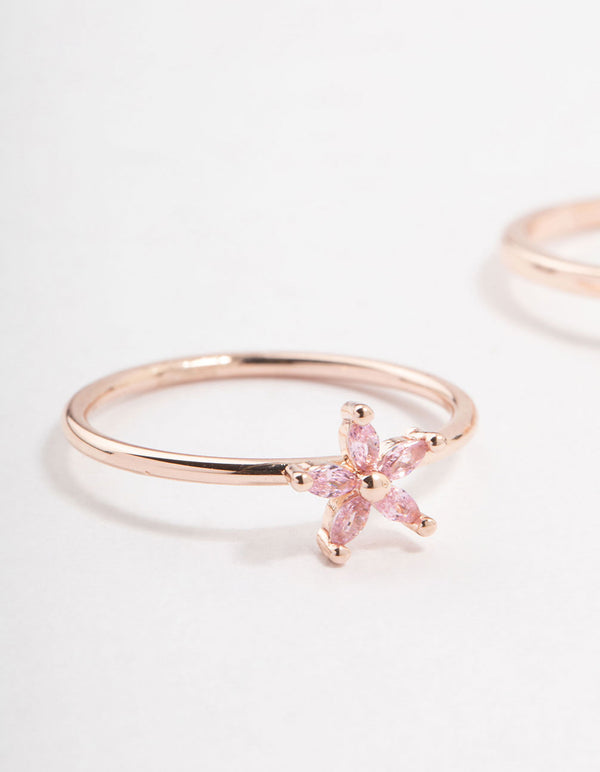 Highlighting floral design with pink stones crafted from rose gold and cubic zirconia in a 2-pack close up view