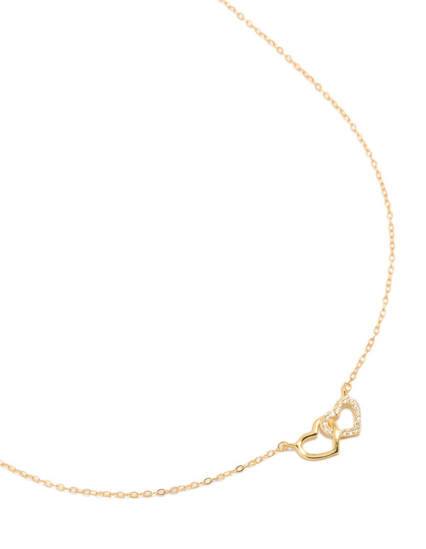 Showcasing a gold plated sterling silver double heart cubic zirconia necklace close up view