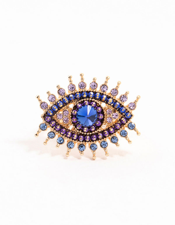 Stunning opulent evil eye ring crafted from gold featuring beads with royal blue, purple and light blue accents close up view