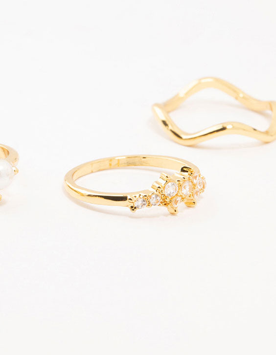 Designed with gold plated pearl cluster rings in a 6-pack featuring clear accents side detail view