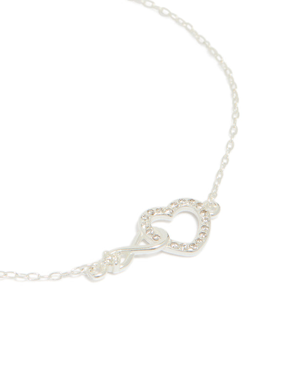 Exquisite sterling silver infinity and cubic zirconia heart link bracelet in silver close up view