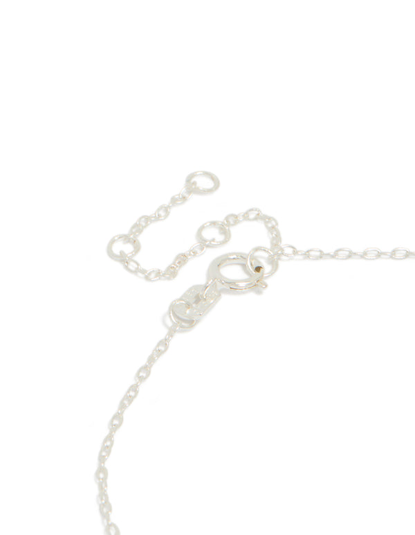 Detailed sterling silver infinity and cubic zirconia heart link bracelet in silver closure detail view