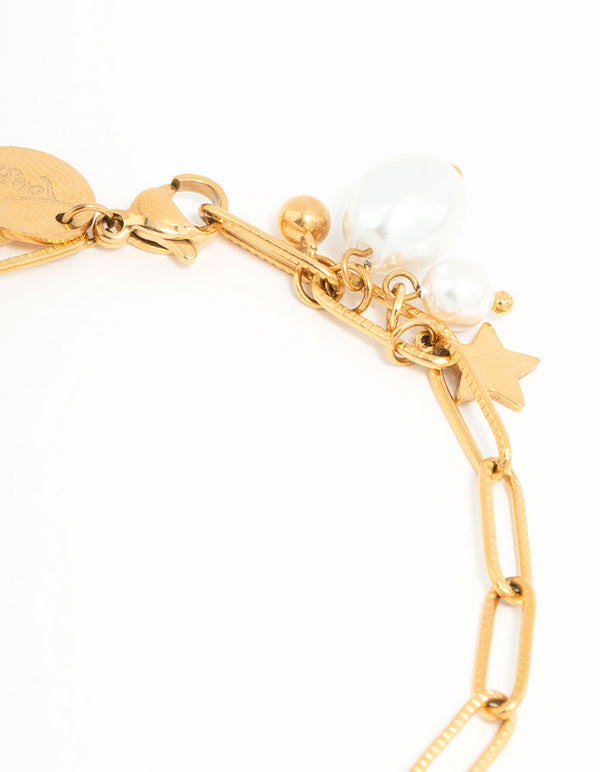 Showcasing waterproof gold plated stainless steel bracelet with celestial star charm and pearl accents close up view