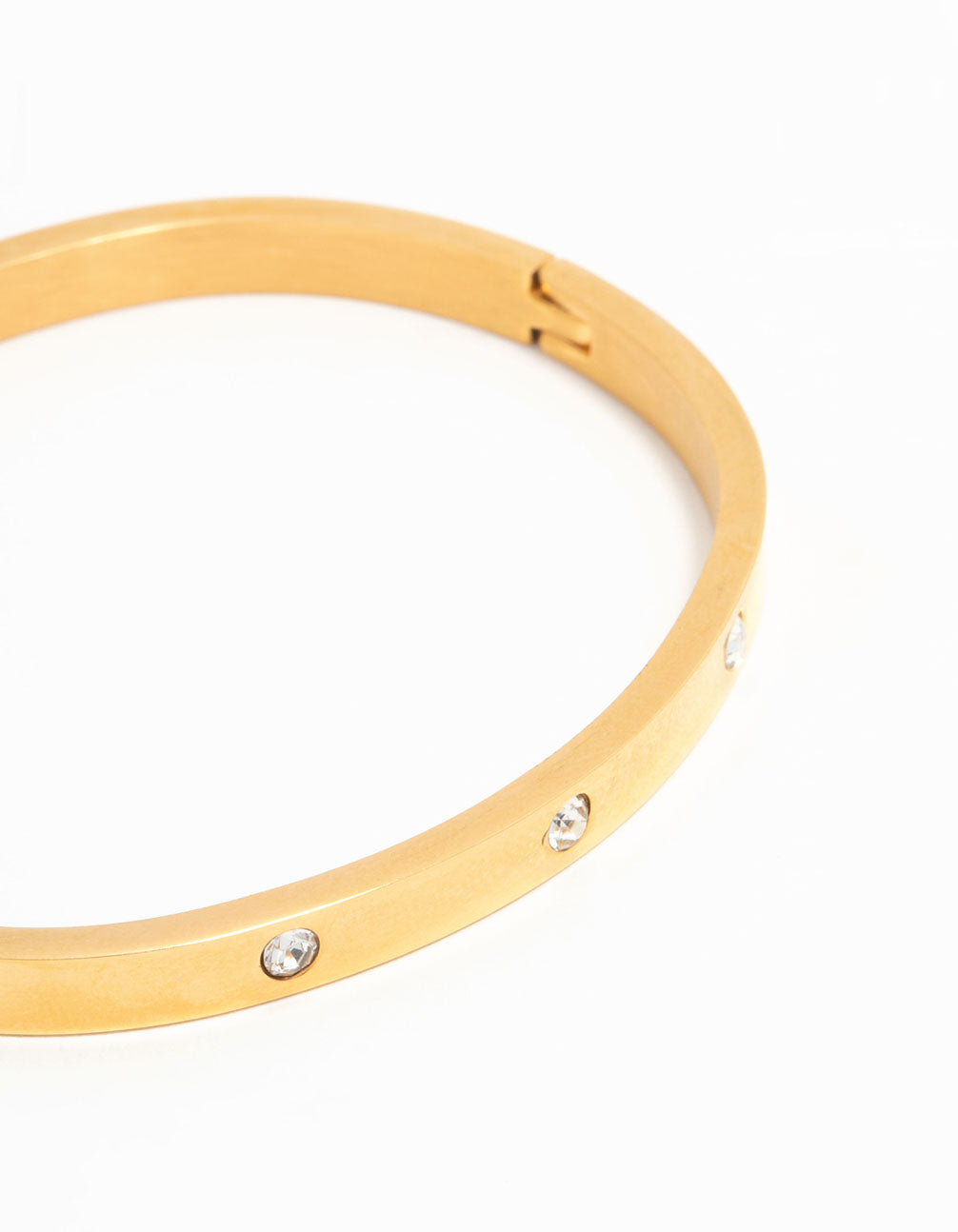 Featuring waterproof gold plated stainless steel diamante hinge bangle with crystal embellishments close up view