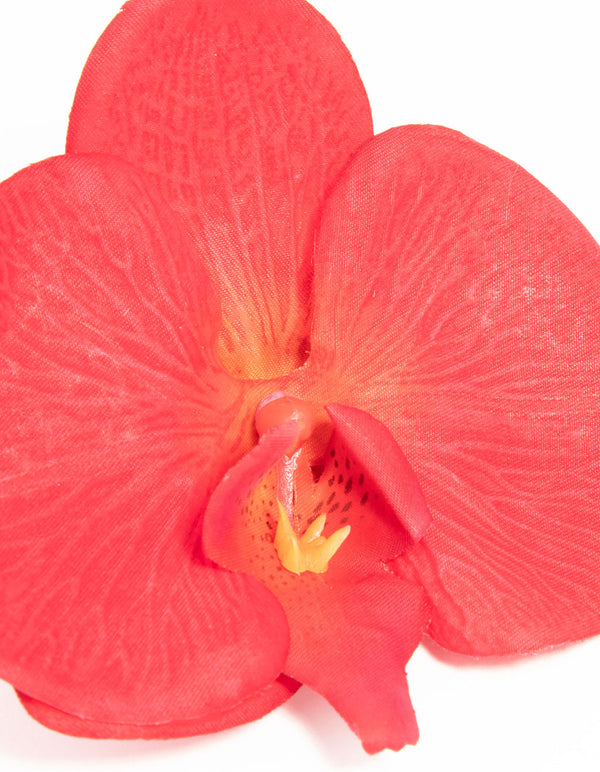 Crafted from pink fabric with floral orchid design in coral, tomato, orange detail view
