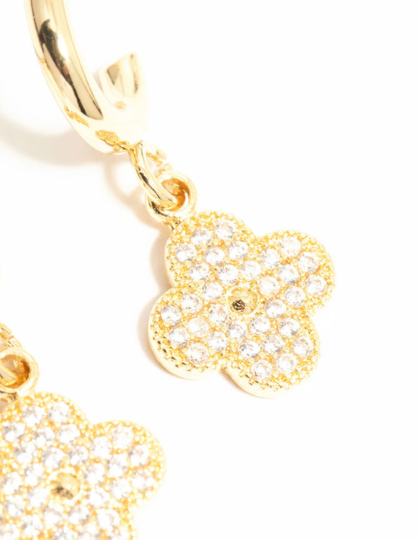 Detailed view of gold plated cubic zirconia flower drop earrings featuring floral design and hoop construction close up view