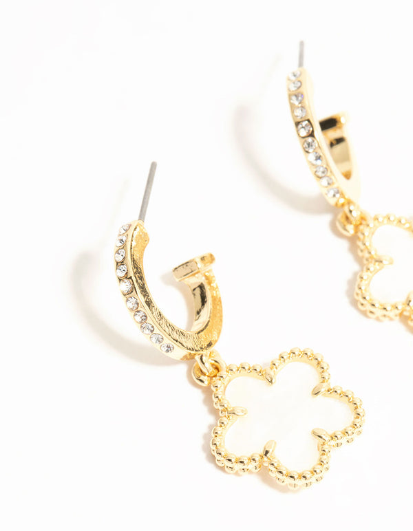 Detailed view of gold plated flower drop diamante hoop earrings in white close up view