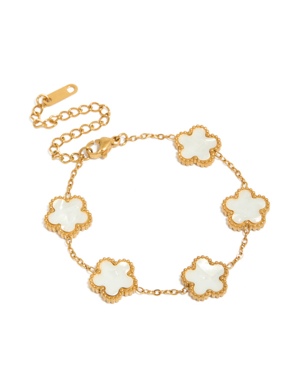 Showcasing a waterproof gold plated stainless steel flower petal charm bracelet with ivory floral accents front view