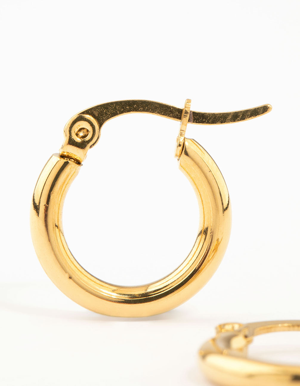 Displaying waterproof gold plated stainless steel clean hinge hoop earrings close up view