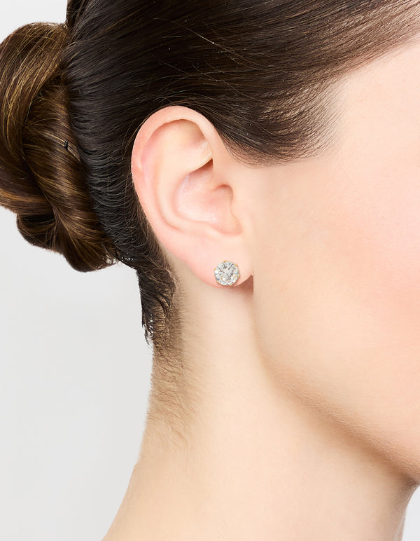 Elegantly crafted waterproof stainless steel cubic zirconia stud earrings with gold plated finish on ear view