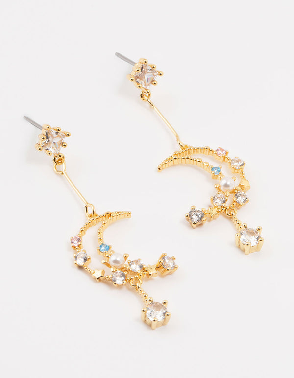 Crafted from gold plated metal, these cubic zirconia moon drop earrings feature celestial accents with pearl details front view