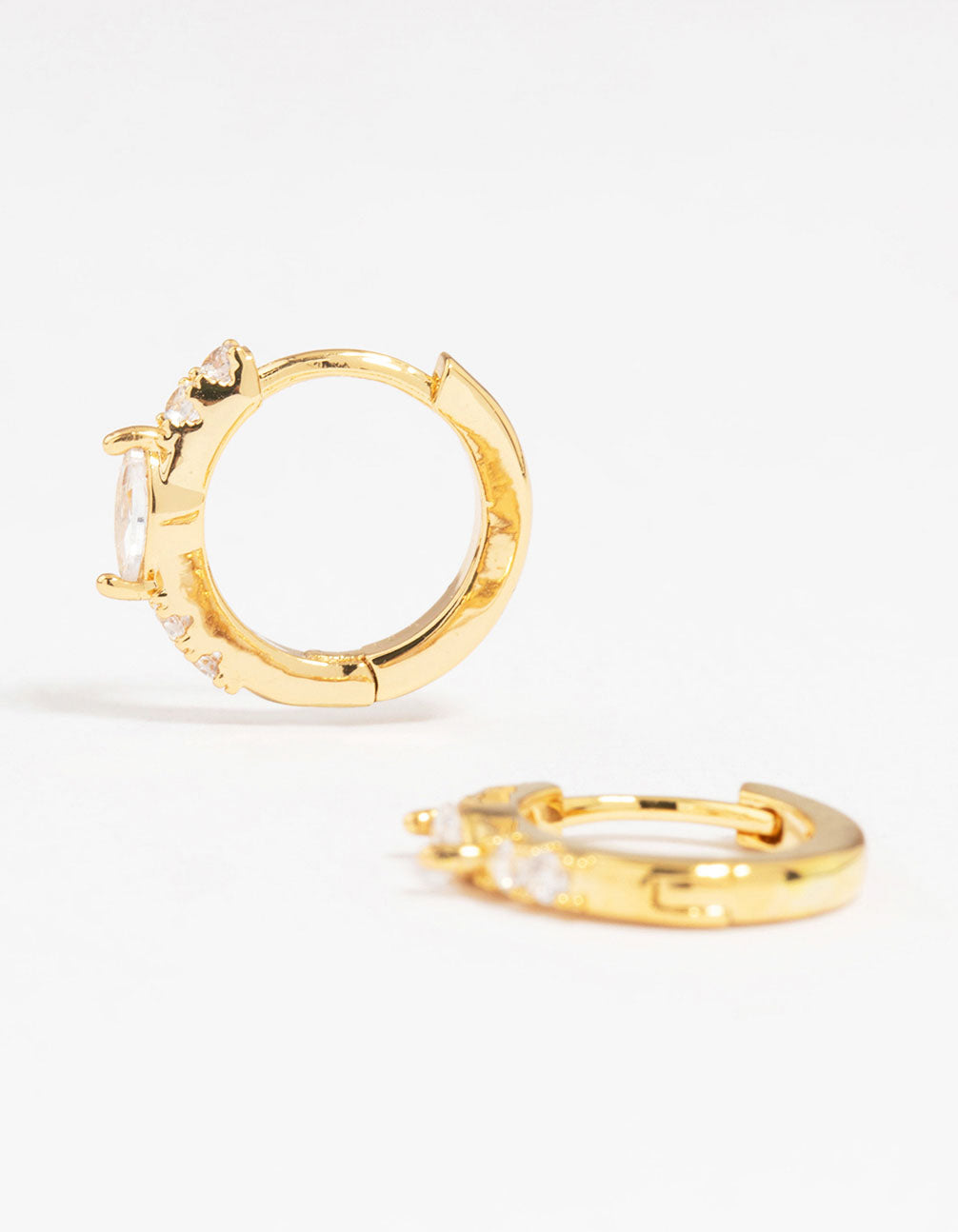 Beautifully crafted gold plated diamante marquise pave huggie earrings front view