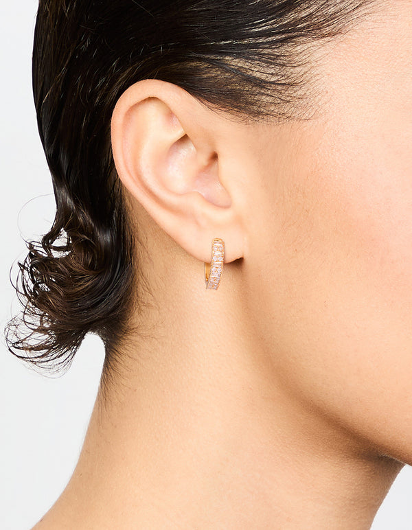 Featuring gold plated diamante baguette pave hoop earrings with clear stones on ear view