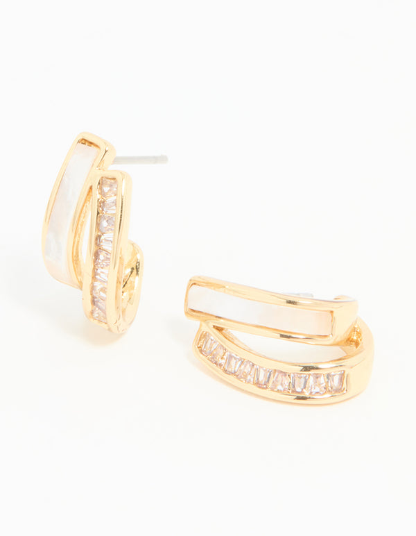 Showcasing statement jacket earrings crafted from gold plated cubic zirconia with mother of pearl accents front view