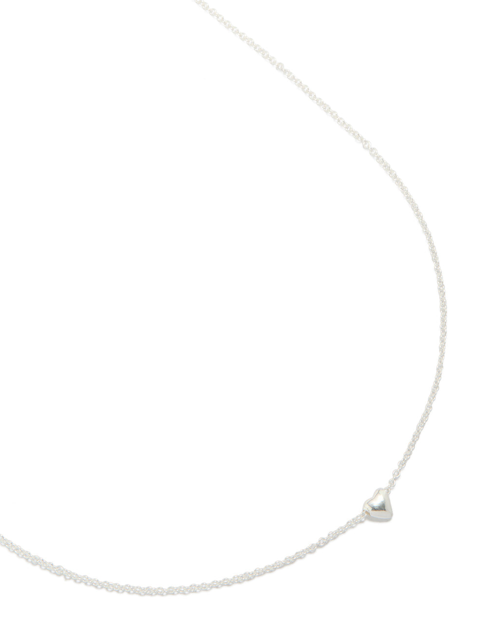 Crafted from sterling silver, this heart pendant necklace is shown in a close up view