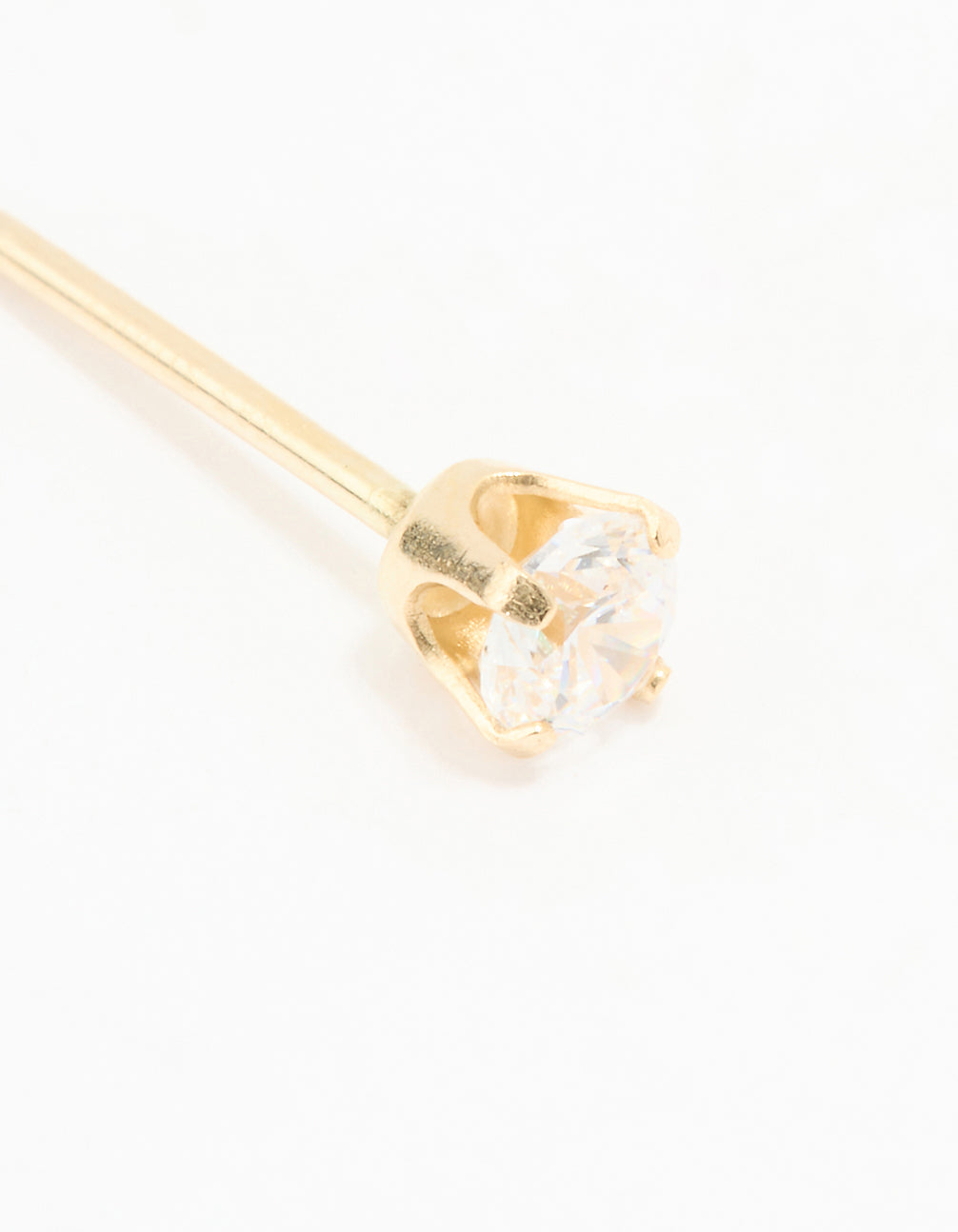 Close-up of 14K solid yellow gold 3MM cubic zirconia piercing stud with crystal and stud closure close up view