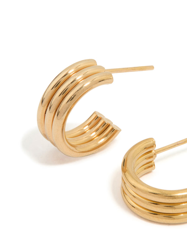 Designed with waterproof gold plated stainless steel fluted hoop earrings in gold close up view