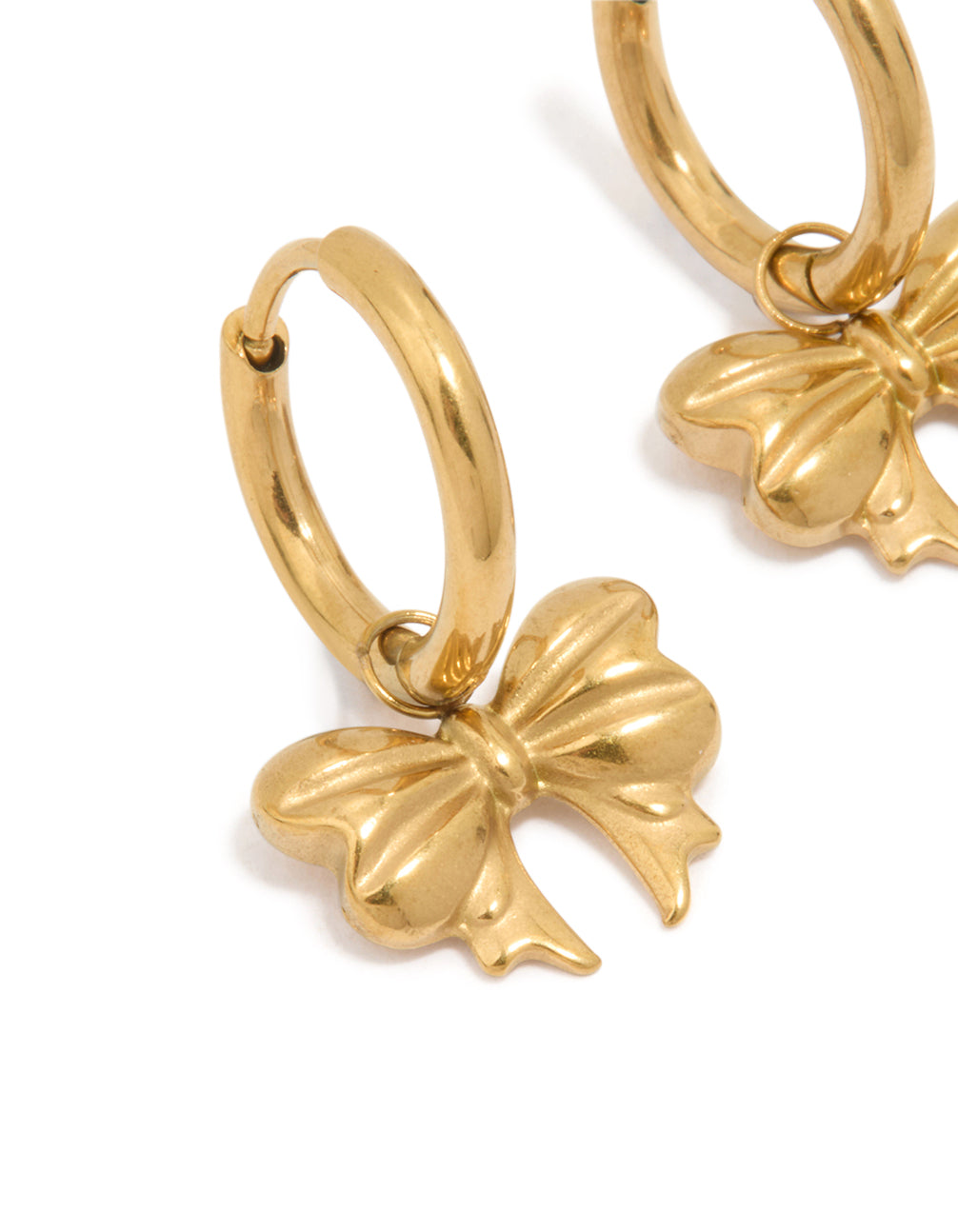 Highlighting bow hoop earrings in waterproof gold plated stainless steel close up view