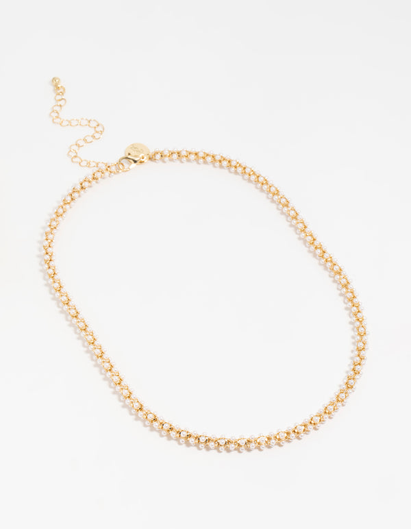 Showcasing a gold plated pearl fireball bracelet in white front view