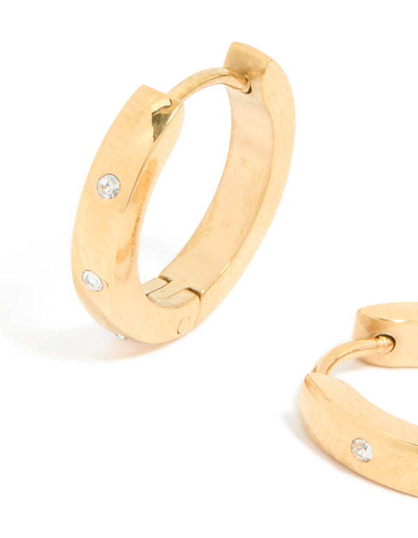 Presenting waterproof gold plated stainless steel cubic zirconia trio huggie earrings with clear details close up view