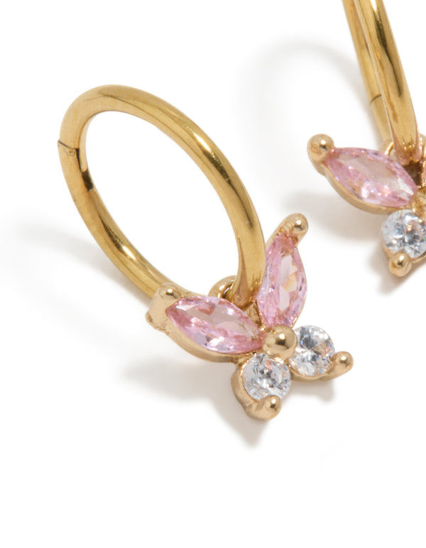 Showcasing gold plated surgical steel butterfly sleeper earrings with pink cubic zirconia close up view