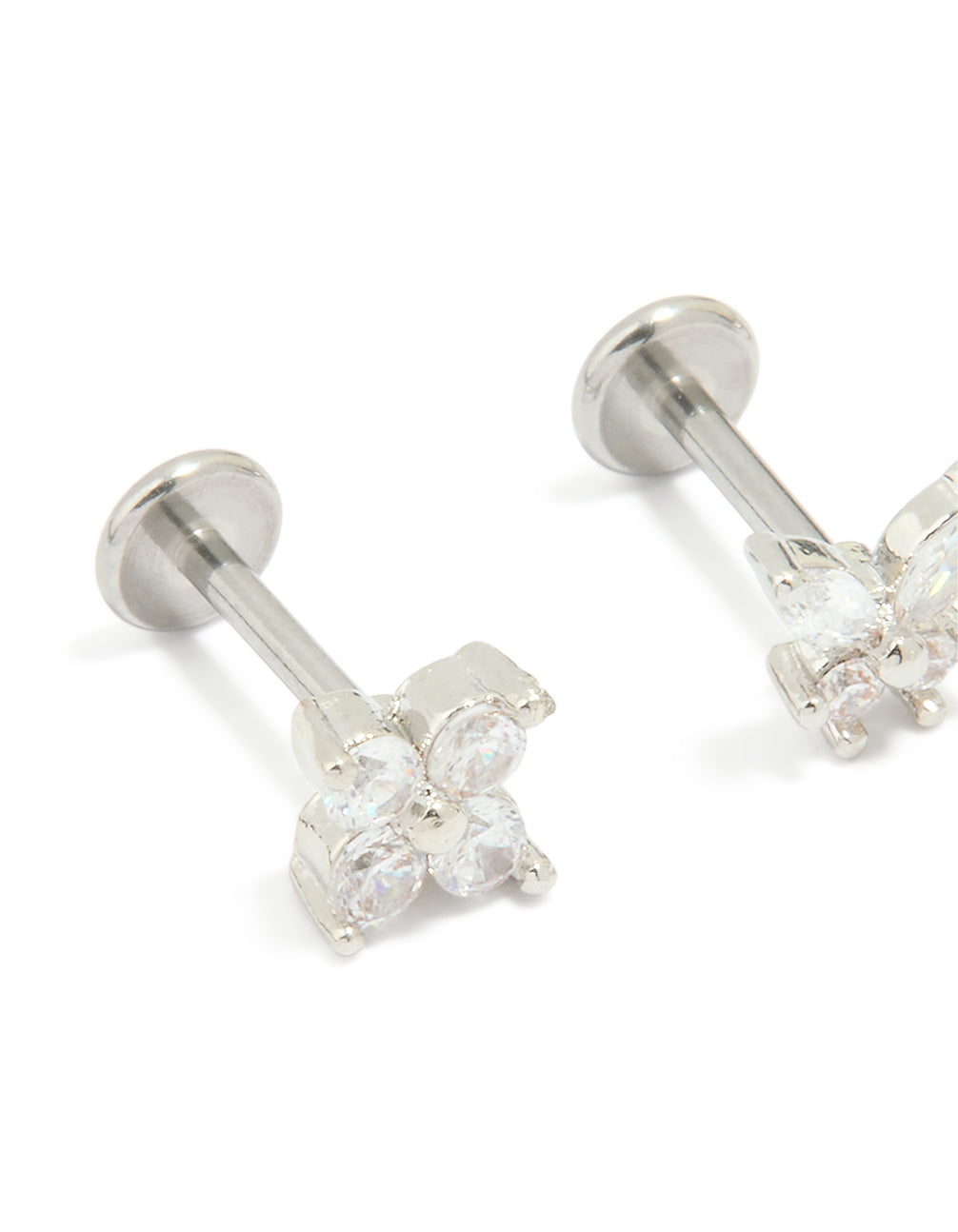 Crafted from surgical steel, these cubic zirconia floral, butterfly flat back studs in a 3-pack feature silver and white detailing close up view
