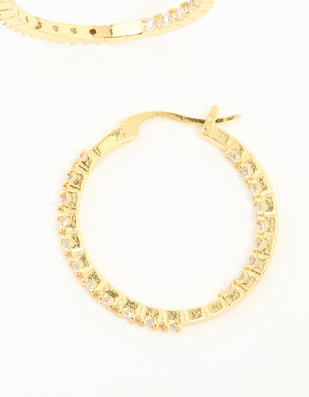Highlighting the hoop closure mechanism on these gold plated statement large skinny earrings with cubic zirconia post detail view