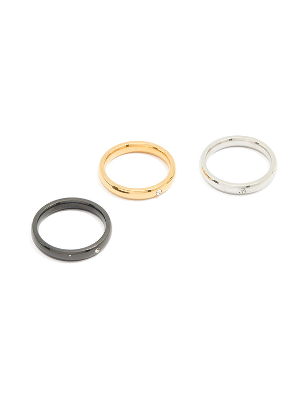 Crafted from waterproof mixed stainless steel dainty rings in a 3-pack featuring gold, silver, and black finishes front view
