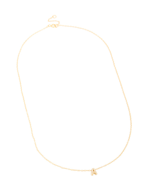 Highlighting a gold plated sterling silver cubic zirconia pavé letter A necklace with initials and statement styling in gold and clear front view