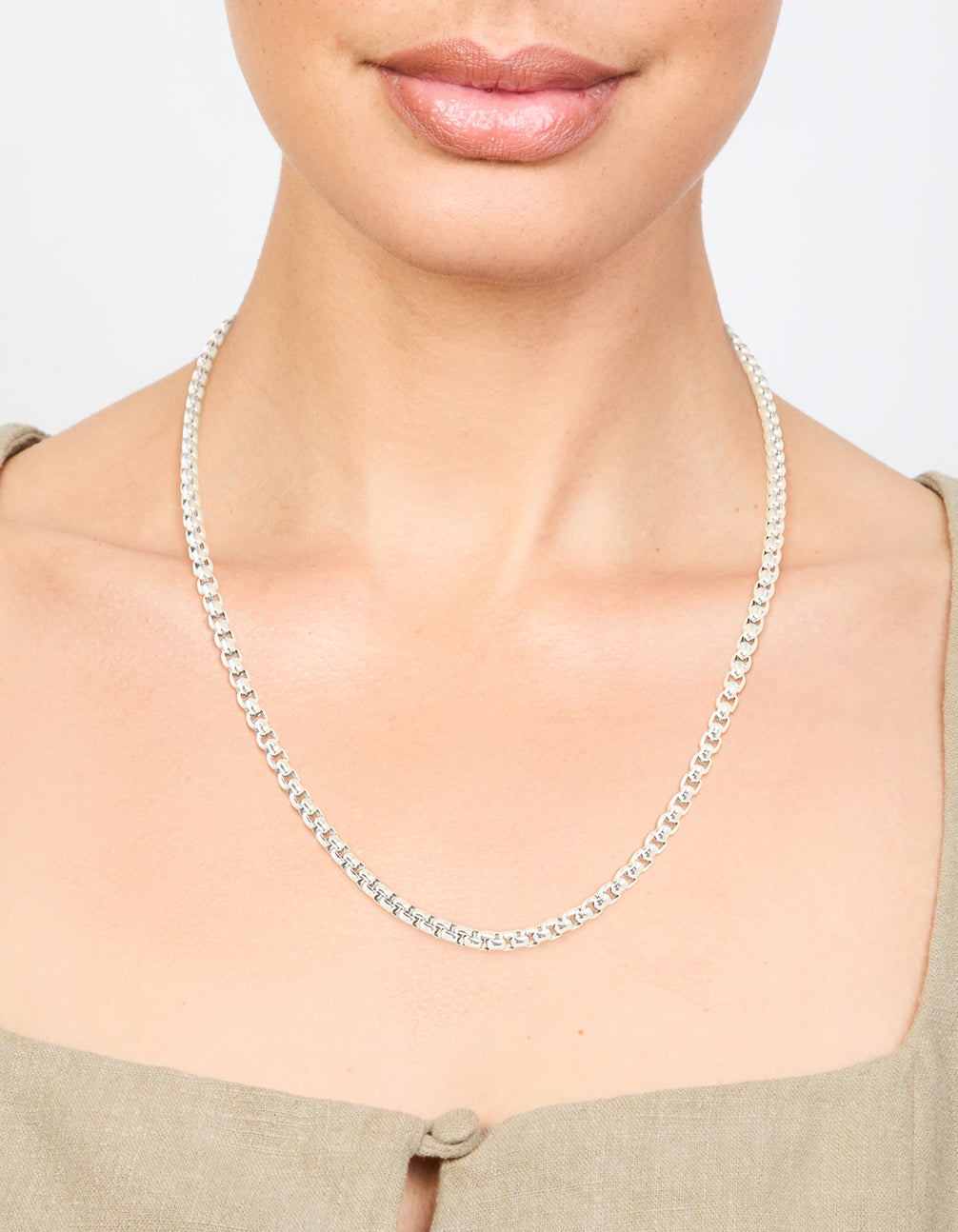 Featuring a waterproof stainless steel round box chain short necklace in silver on neck view