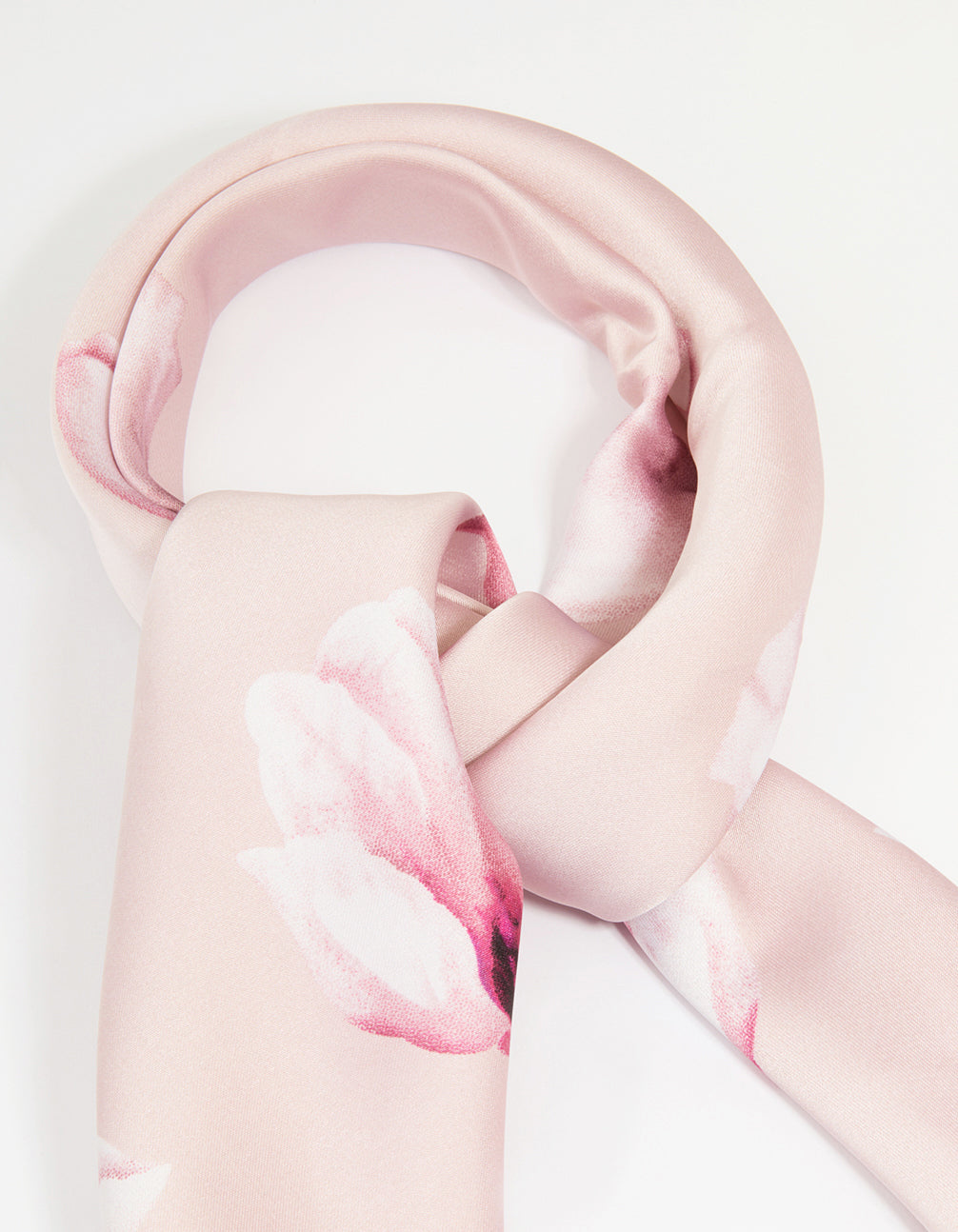 Beautifully designed fabric scarf in light pink with flower border showcasing white floral pattern side view