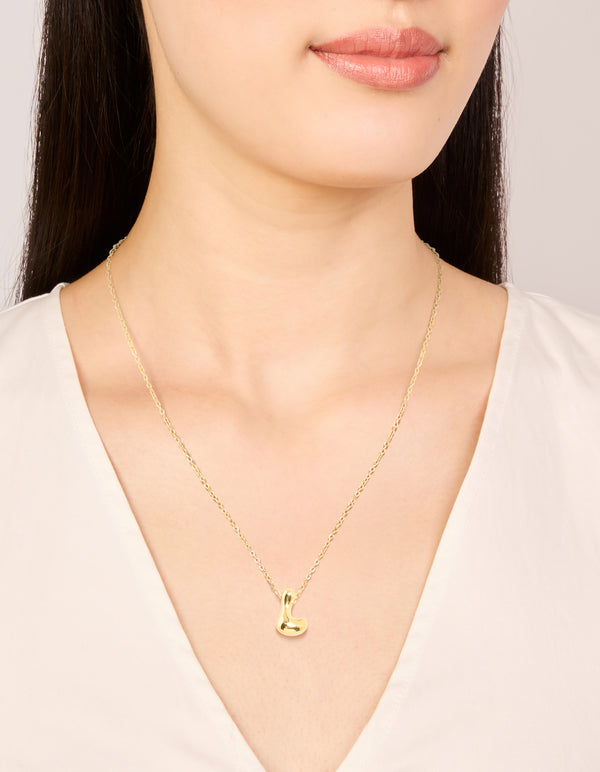 Featuring a waterproof large bubble letter L dainty necklace in stainless steel with pendant displaying initials on neck view