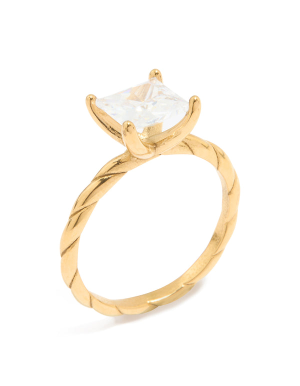 Featuring a waterproof cubic zirconia square ring in gold plated stainless steel with twisted band side detail view